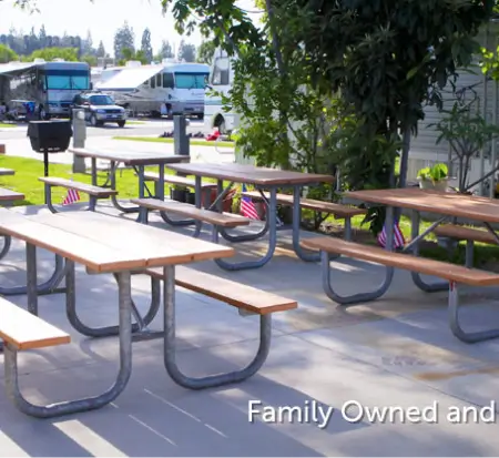 Picnic tables at sunny RV park campground