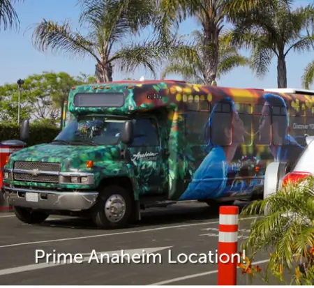 Colorful bus in Anaheim with vibrant graphics.