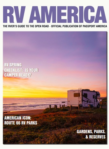 RV magazine cover with sunset and camper by the sea.