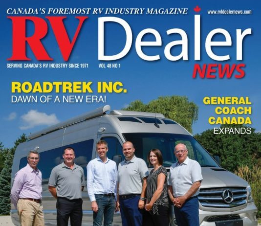 RV Dealer magazine cover with executives and new RV model.