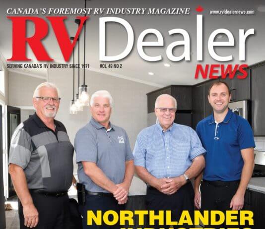 Four men on cover of RV Dealer News magazine