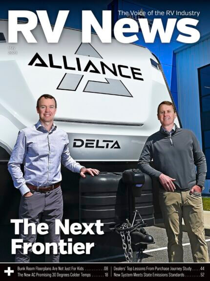 Two men standing in front of RV for "RV News" magazine.