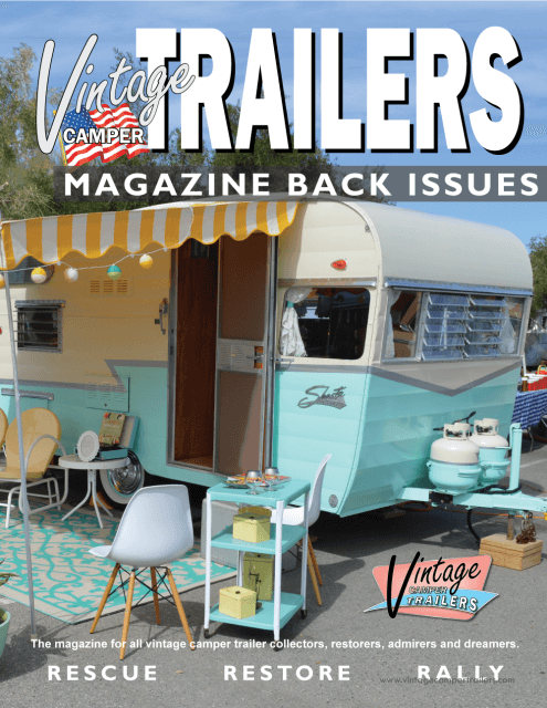 Retro styled vintage camper trailer at outdoor rally.