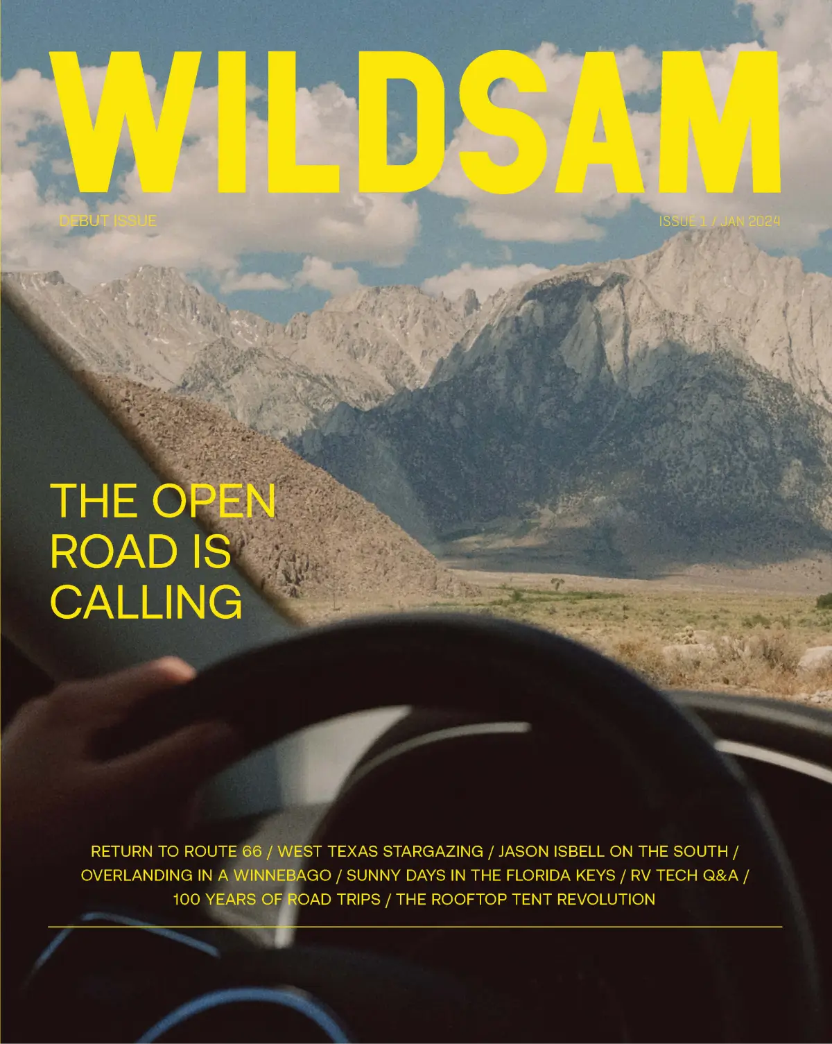 Magazine cover, road trip theme, steering wheel, mountains view.