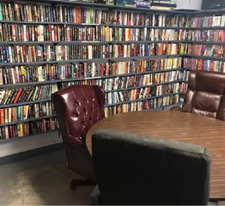 Bookstore reading area with leather chairs and bookshelves