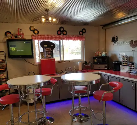 Retro diner-style kitchen with red accents and jukebox.