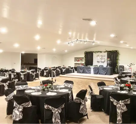 Elegant banquet hall decorated for quinceañera celebration.