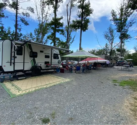 Campers enjoying outdoor RV camping with tents.