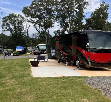 RVs parked at a campground with amenities.