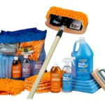 Car wash cleaning kit with soaps and microfiber accessories.