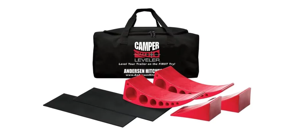 Red camper levelers with black mat and carrying bag.