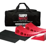 Red camper levelers with black mat and carrying bag.